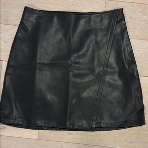 Hollister black faux leather mini skirt with fake wrap. Size Small. Perfect!